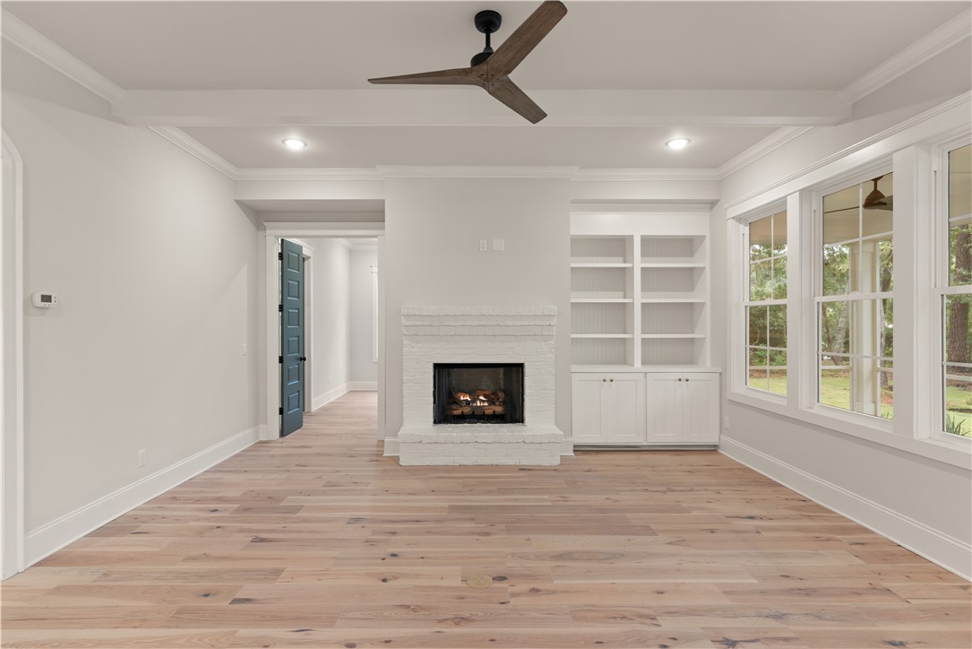 156 Rice Mill St. Simons Island, GA 31522 - Photo 12 of 36 So cozy with gas fireplace logs and bookshelves.
