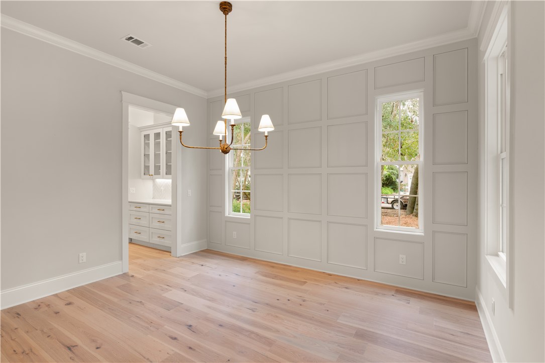 156 Rice Mill St. Simons Island, GA 31522 - Photo 9 of 36 Formal Dining Room. Notice the detailed wall.