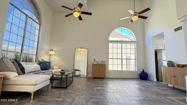a living room with furniture and a window