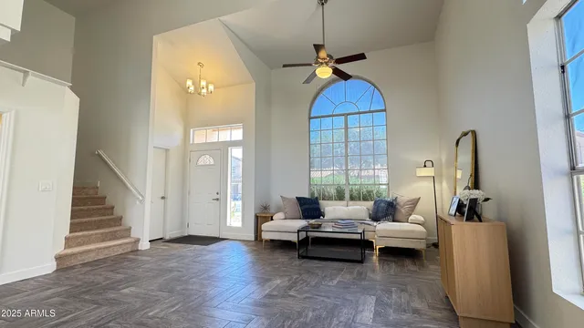 a view of a livingroom with furniture and stairs