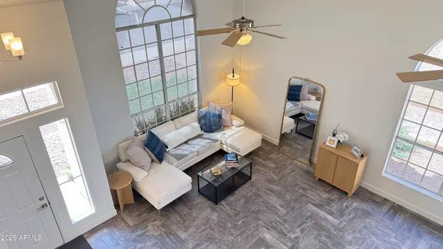 a dining room with furniture a window and wooden floor