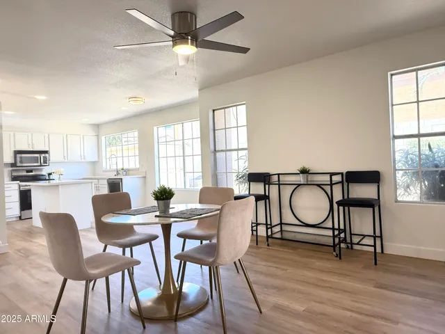 a view of a dining room with furniture and window