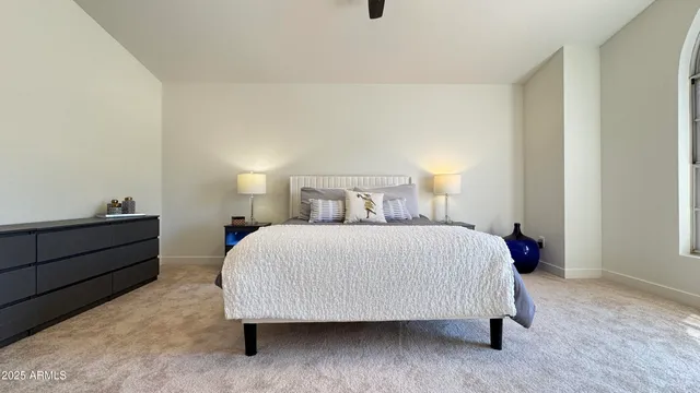 a bed room with a bed and a window