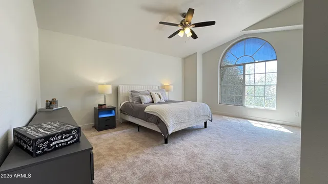 a bedroom with a bed and window