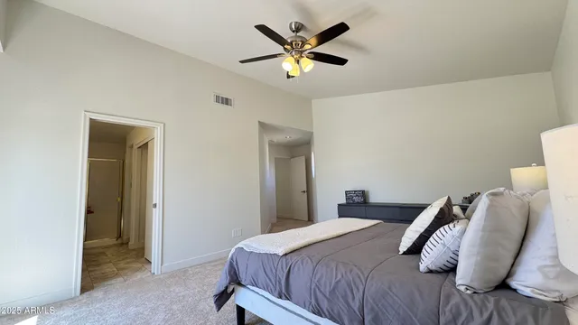 a spacious bathroom with a granite countertop sink a mirror and a