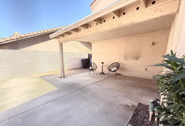 a view of a room with a floor to ceiling window and backyard