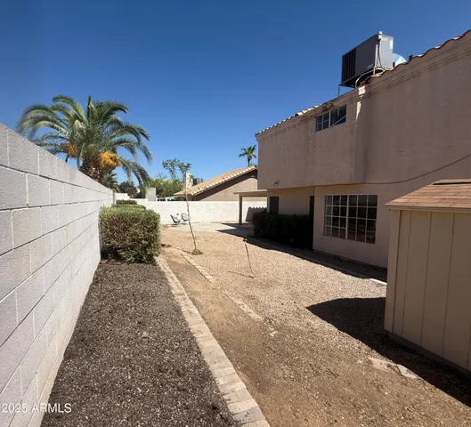 a view of a backyard and a kitchen