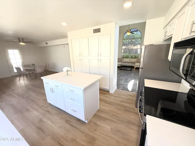a room with wooden floor and furniture