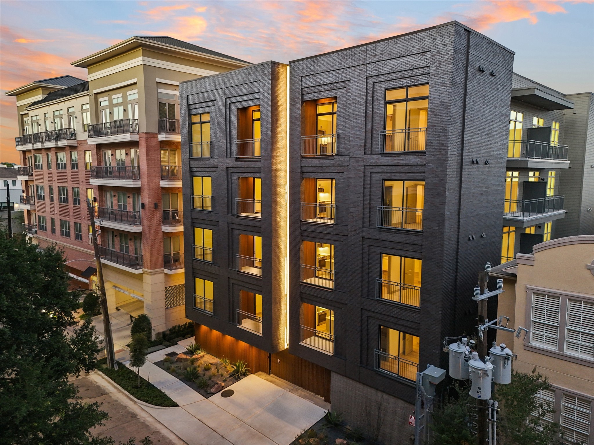 170 Malone Street, Unit 3401 Houston, TX 77007 - Photo 10 of 28 This new building is a modern, multi-story apartment with sleek architectural design and large, illuminated windows. Stylish urban living space.
