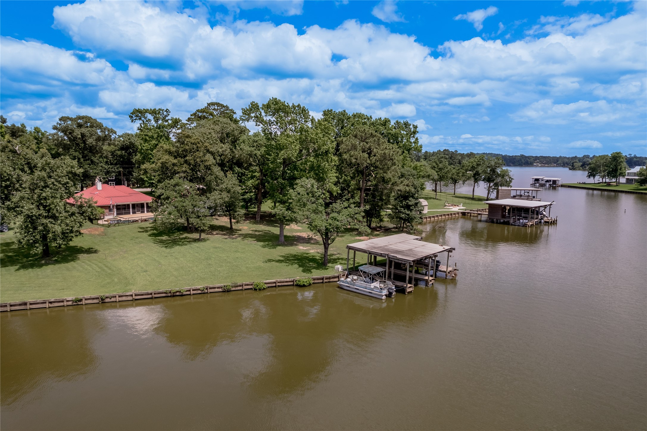 324 Red Oak Lane Trinity, TX 75862 - Photo 5 of 49 a view of a lake with outdoor seating