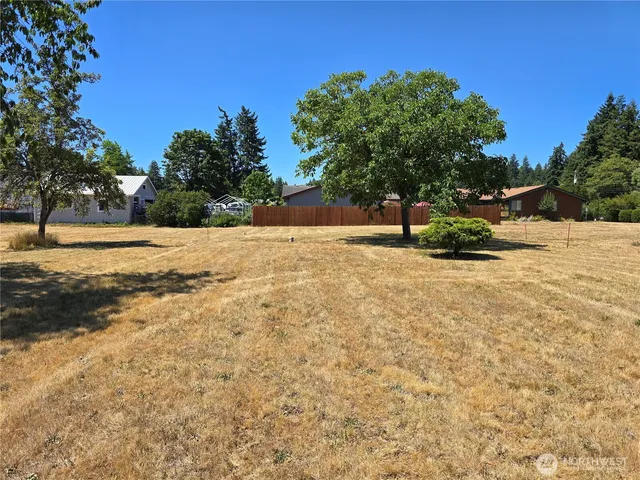 a backyard of a house with lots of green space