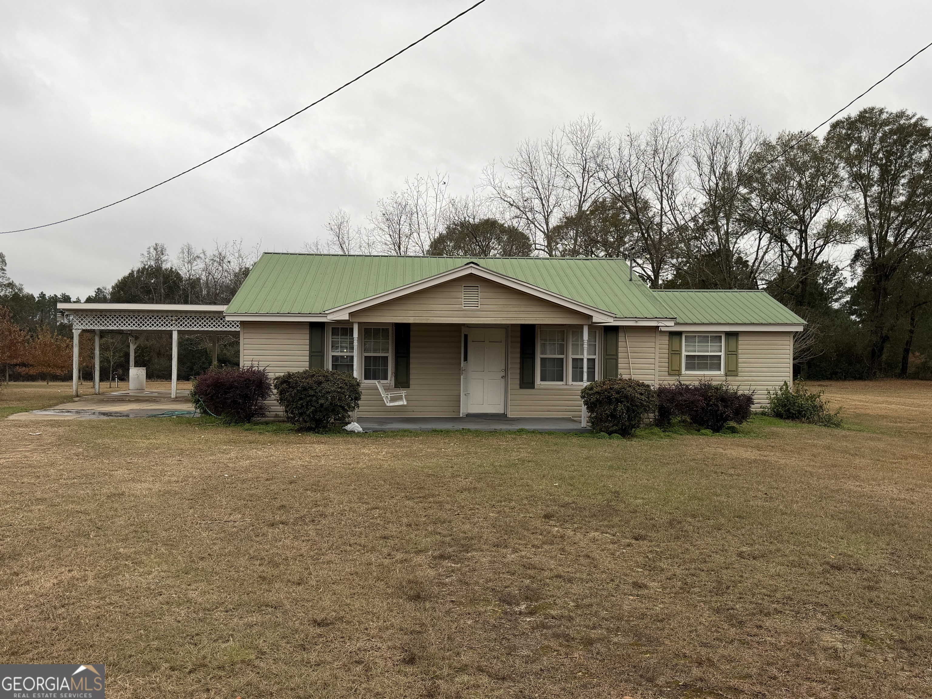 2846 Walnut Avenue Cadwell, GA 31009 - Photo 1 of 2 a front view of a house with a garden