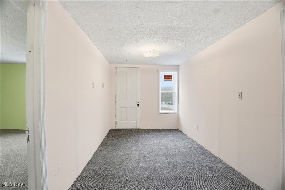 8045 Veto Road Belpre, OH 45714 - Photo 43 of 50 Empty room with carpet and a textured ceiling