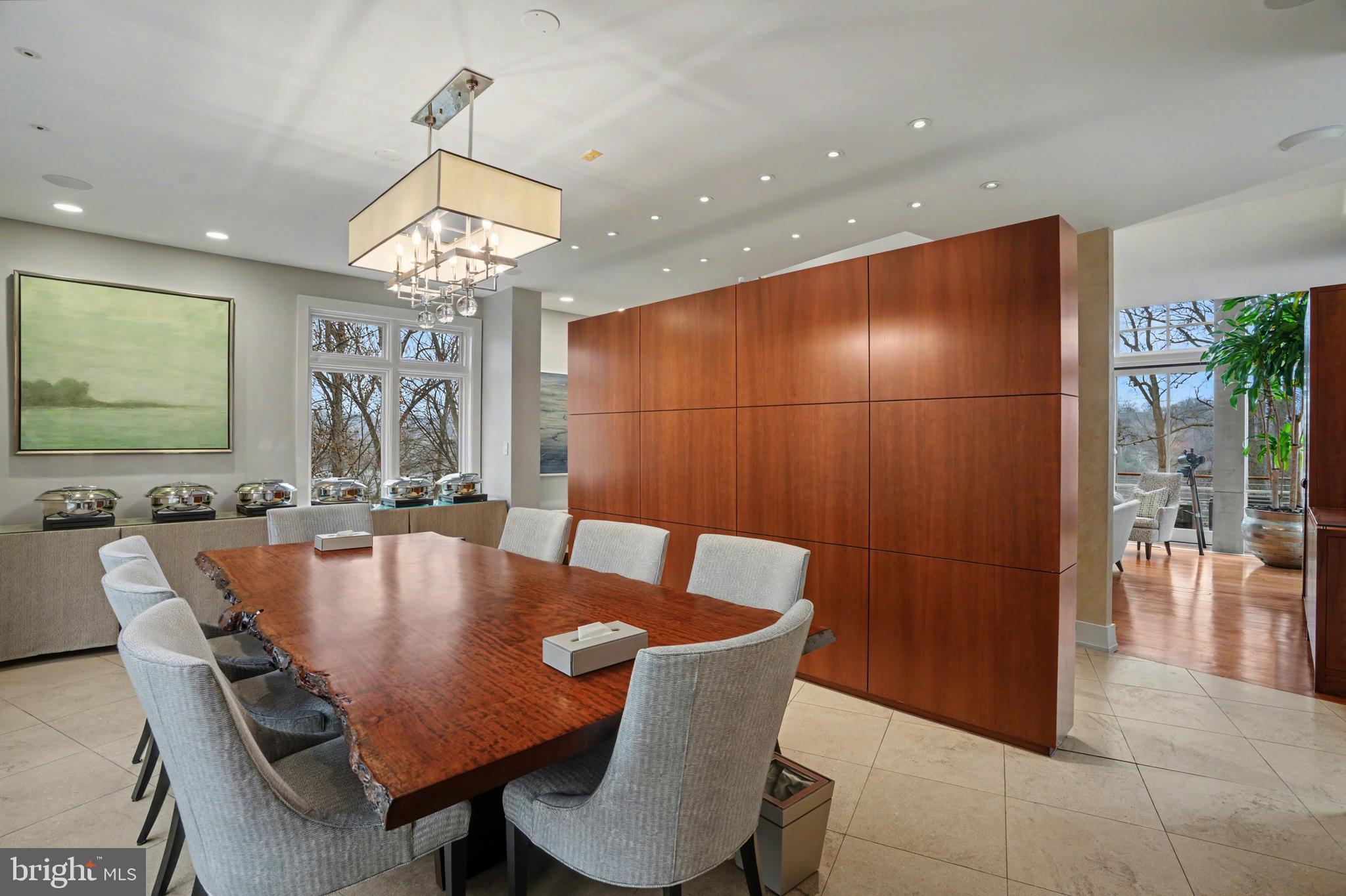 1100 Crest Lane McLean, VA 22101 - Photo 14 of 49 a dining room with furniture a chandelier and wooden floor