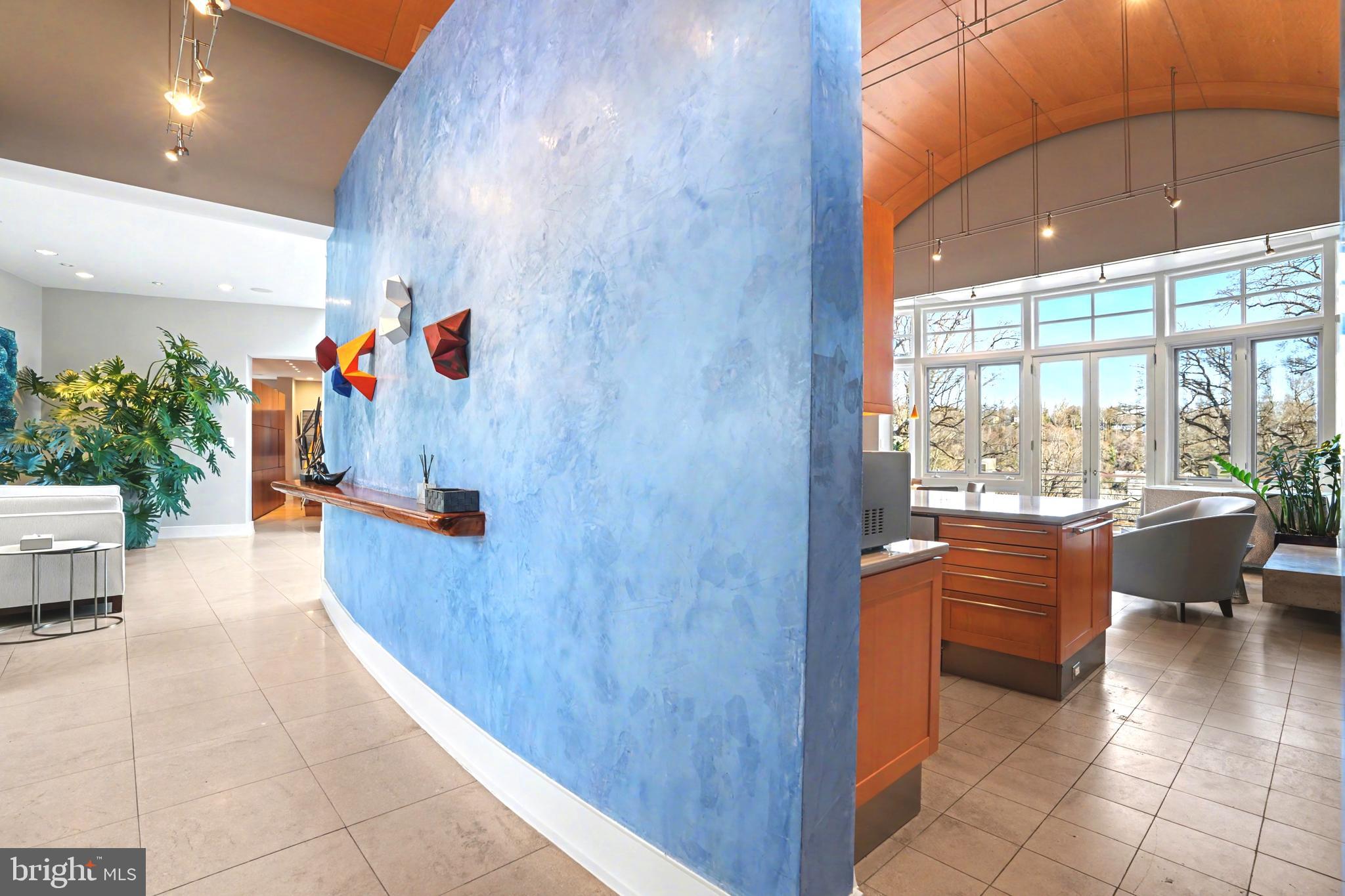 1100 Crest Lane McLean, VA 22101 - Photo 19 of 49 a view of lobby with a floor to ceiling window and outdoor kitchen
