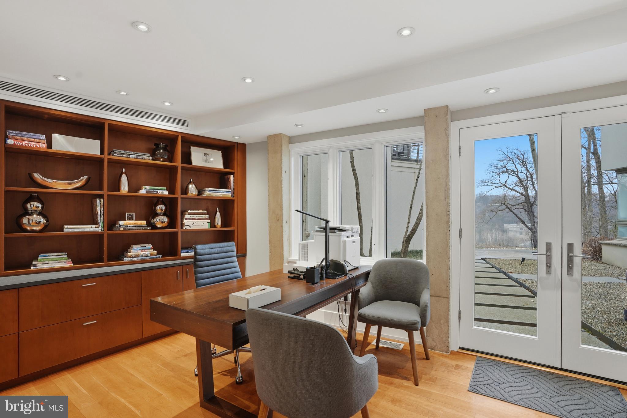 1100 Crest Lane McLean, VA 22101 - Photo 40 of 49 a living room with furniture a bookshelf and a window