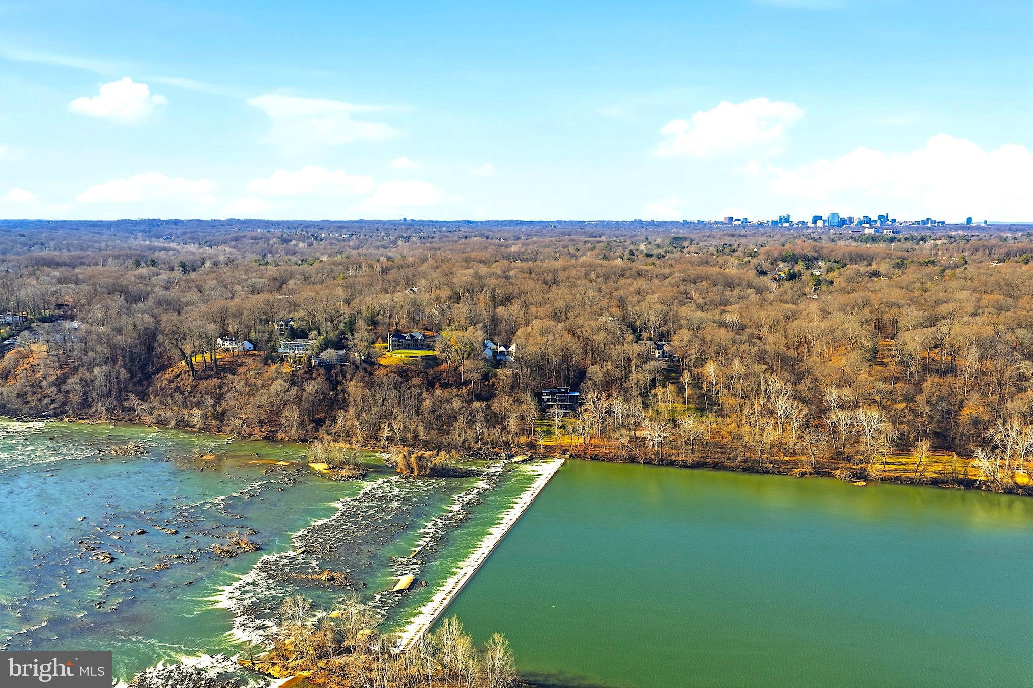 1100 Crest Lane McLean, VA 22101 - Photo 6 of 49 a view of a lake with houses in the back