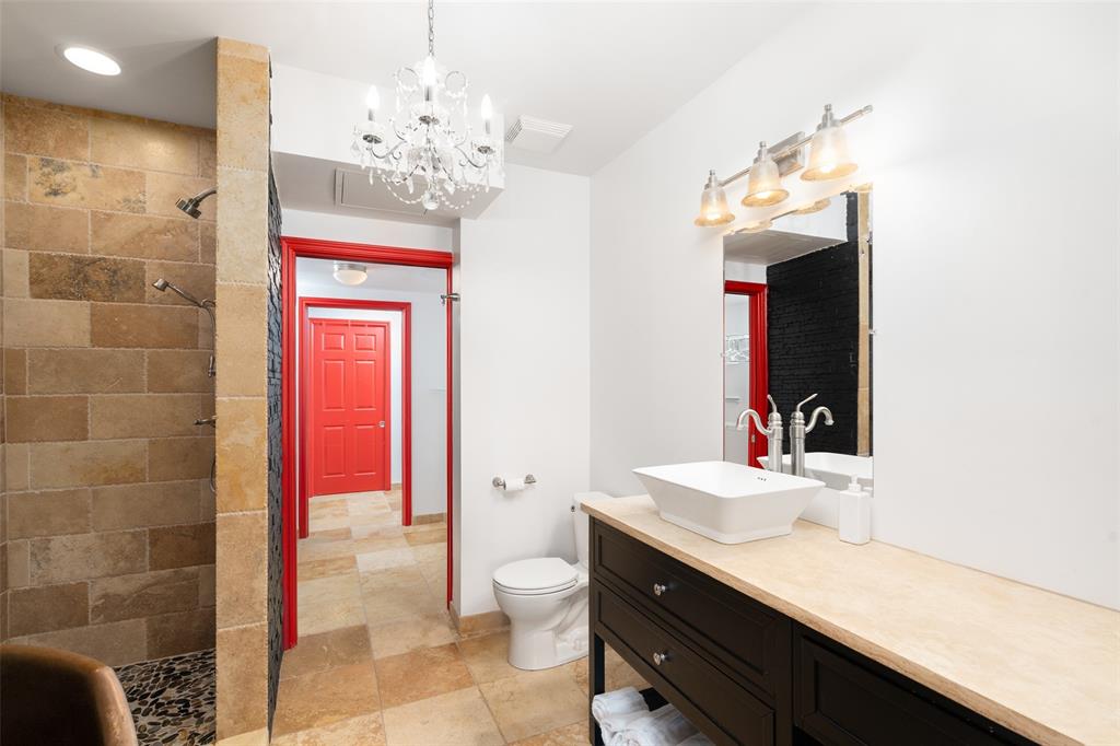 511 North Akard Street, Unit 1502 Dallas, TX 75201 - Photo 12 of 30 Easily pass through primary bath, closet, and utility room to reach secondary bedroom