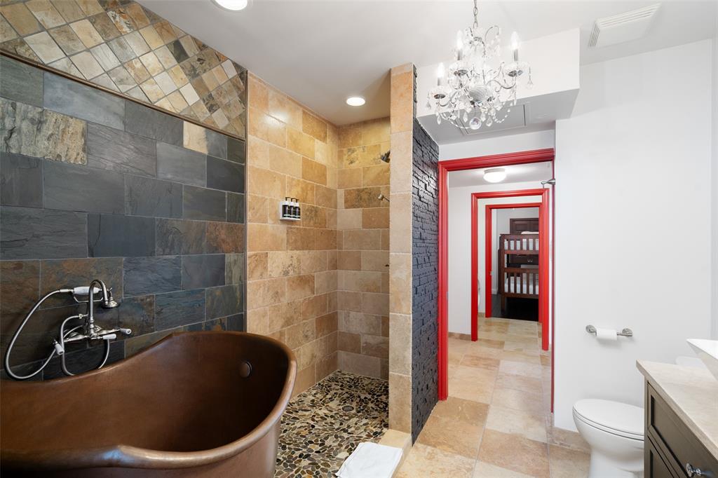 511 North Akard Street, Unit 1502 Dallas, TX 75201 - Photo 13 of 30 Japanese soaking tub and separate shower in primary bath
