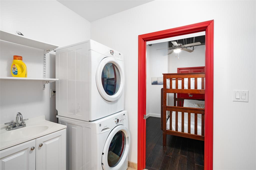 511 North Akard Street, Unit 1502 Dallas, TX 75201 - Photo 15 of 30 Full utility room features sink and stackable w/d and sink