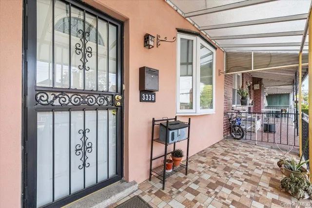 a very nice looking room with a large window and furniture