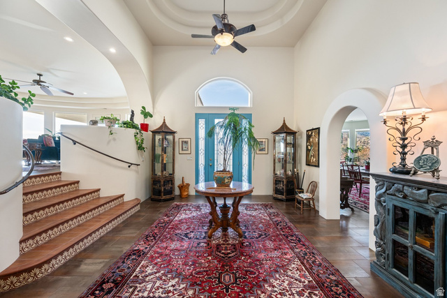 779 South Silver Road Leeds, UT 84746 - Photo 11 of 80 Foyer with ceiling fan, arched walkways, a raised ceiling, dark wood-style flooring, and recessed lighting