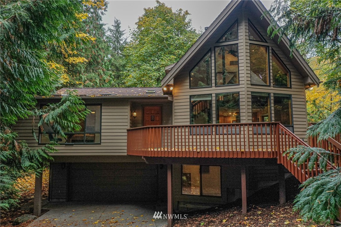 17418 Southeast 106th Street Renton, WA 98059 - Photo 1 of 39 a front view of a house with a garden