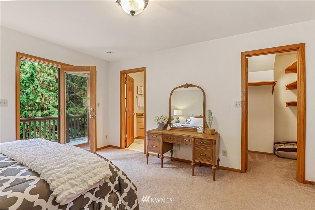 17418 Southeast 106th Street Renton, WA 98059 - Photo 18 of 39 a bedroom with a bed and a large window