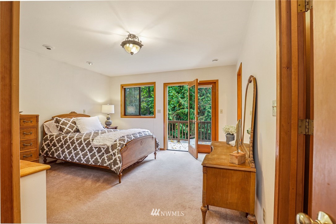17418 Southeast 106th Street Renton, WA 98059 - Photo 19 of 39 a bed room with a bed and a couch