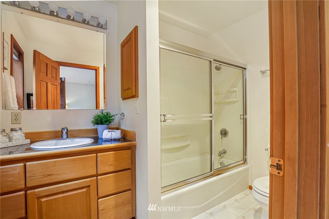 17418 Southeast 106th Street Renton, WA 98059 - Photo 20 of 39 a bathroom with a granite countertop sink mirror and double