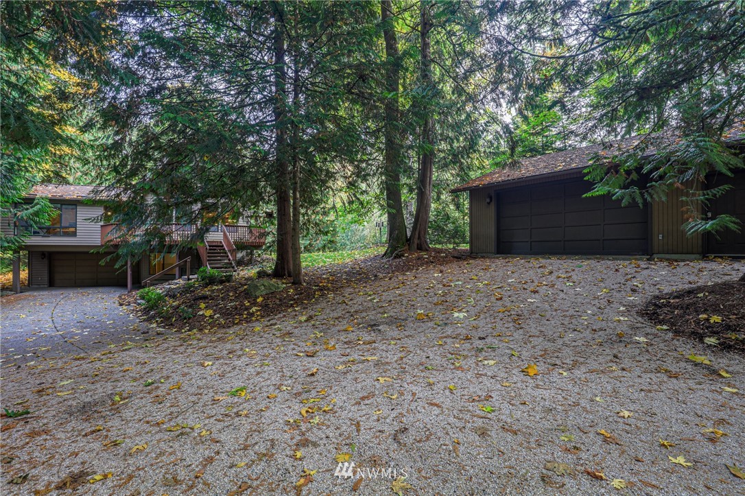 17418 Southeast 106th Street Renton, WA 98059 - Photo 3 of 39 a backyard of a house with lots of green space