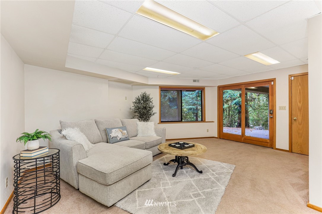17418 Southeast 106th Street Renton, WA 98059 - Photo 26 of 39 a living room with furniture and a large window