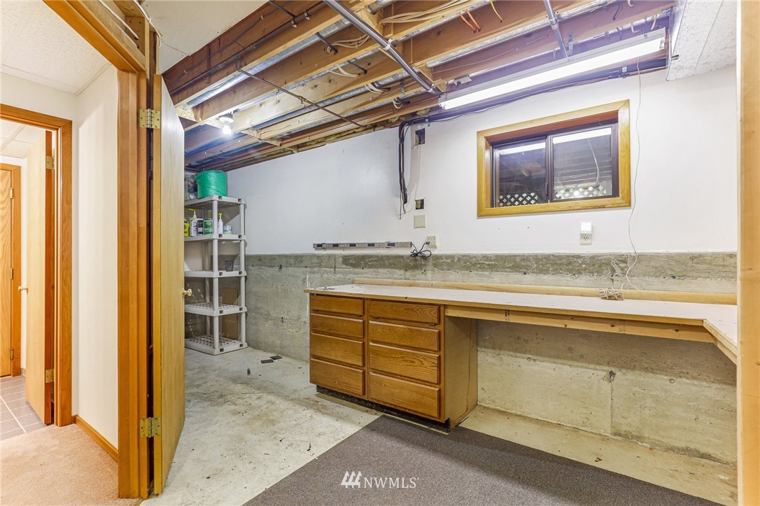 17418 Southeast 106th Street Renton, WA 98059 - Photo 28 of 39 a bathroom with a granite countertop sink mirror and