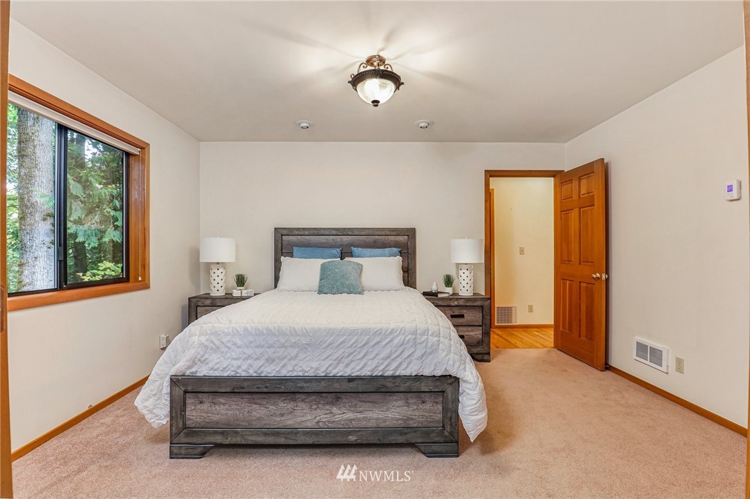 17418 Southeast 106th Street Renton, WA 98059 - Photo 30 of 39 a bedroom with a bed and window