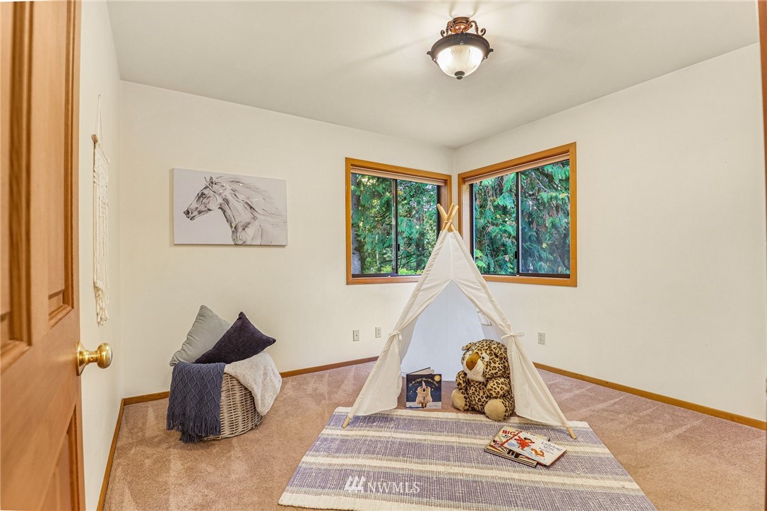 17418 Southeast 106th Street Renton, WA 98059 - Photo 32 of 39 a living room with furniture and a window