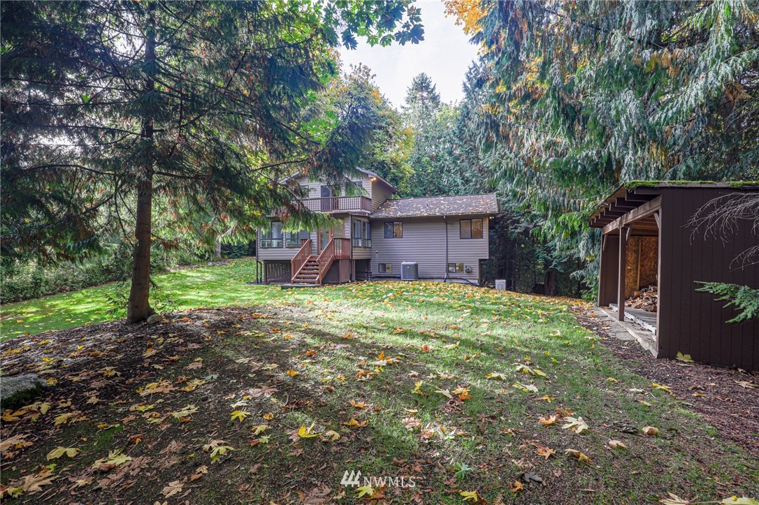 17418 Southeast 106th Street Renton, WA 98059 - Photo 38 of 39 a view of a house with a yard and large trees