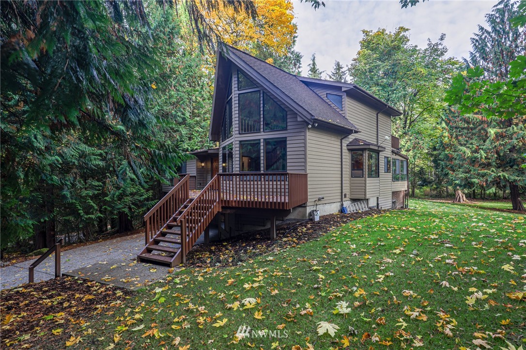 17418 Southeast 106th Street Renton, WA 98059 - Photo 5 of 39 a view of a small house in the back yard