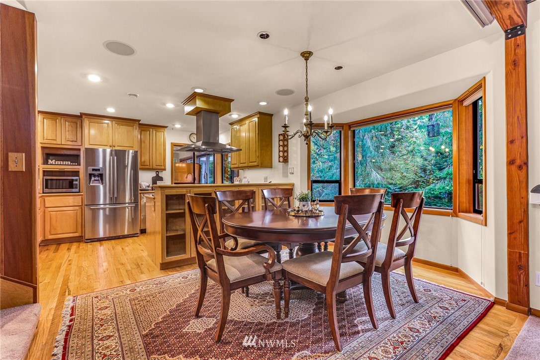 17418 Southeast 106th Street Renton, WA 98059 - Photo 9 of 39 a view of a dining room with furniture window and wooden floor