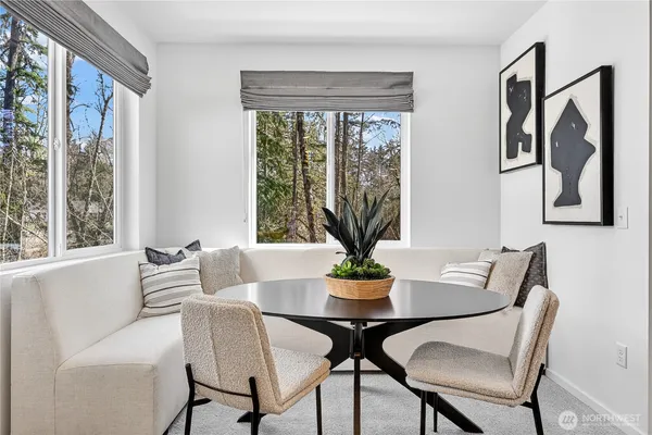a view of a dining room with furniture window and outside view