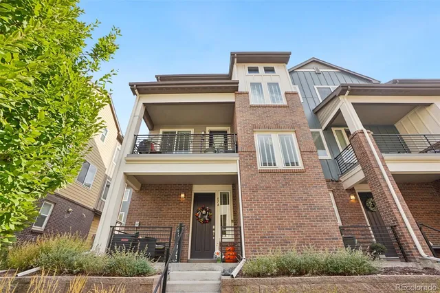 front view of a building with a tree