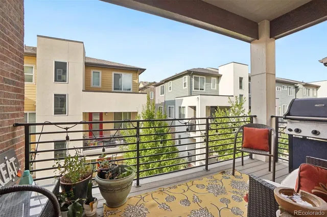a front view of a house with outdoor seating