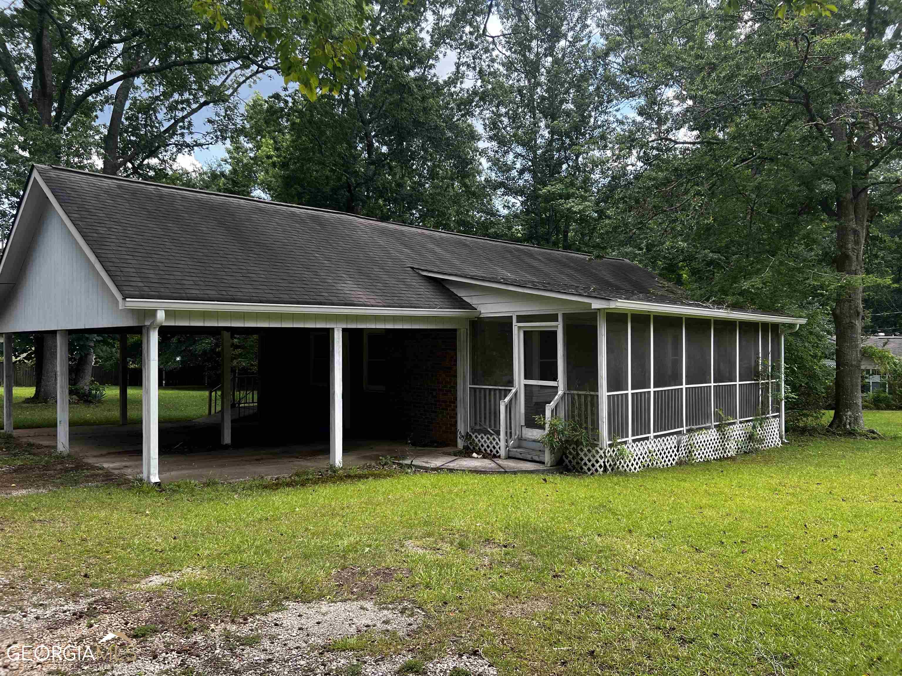 433 Tara Road Jonesboro, GA 30238 - Photo 1 of 1 an outdoor space with wooden fence and large trees