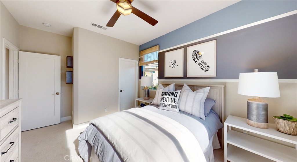 246 Chorus Irvine, CA 92618 - Photo 26 of 75 a bedroom with a bed and a lamp on table