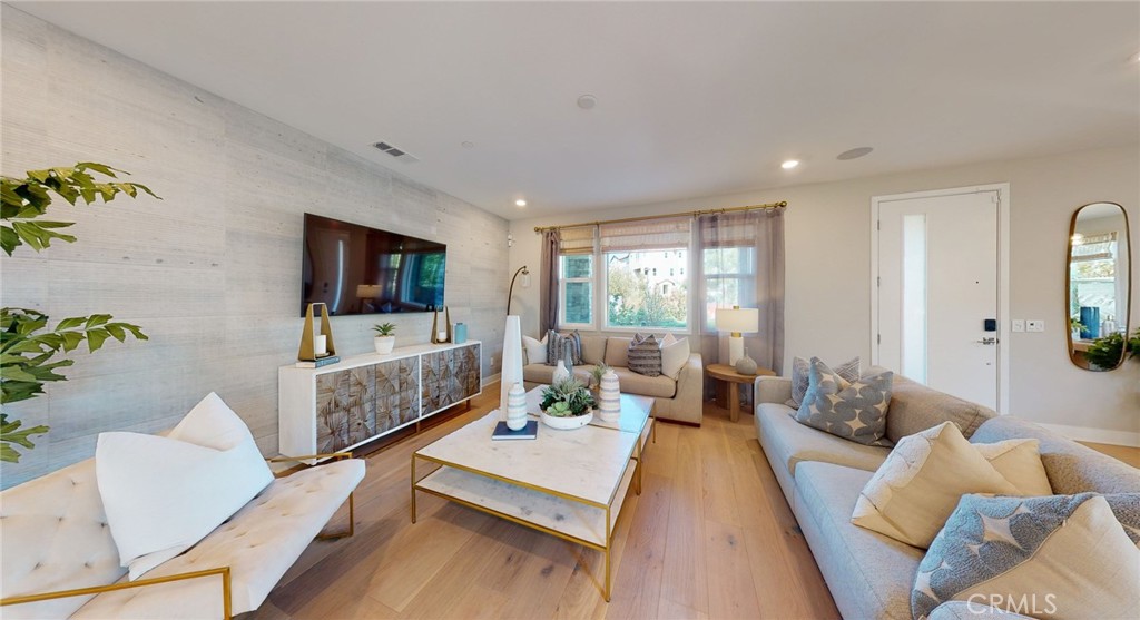 246 Chorus Irvine, CA 92618 - Photo 50 of 75 a living room with furniture and a flat screen tv