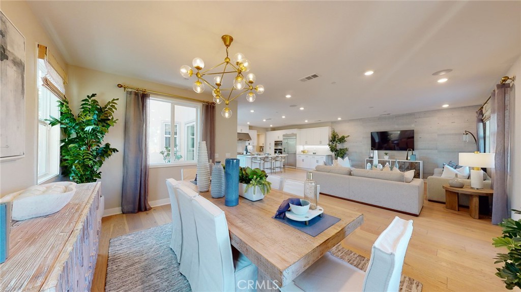 246 Chorus Irvine, CA 92618 - Photo 54 of 75 a view of a dining room with furniture window and wooden floor