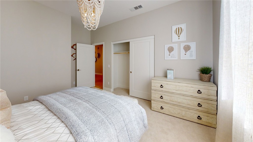 246 Chorus Irvine, CA 92618 - Photo 69 of 75 a bedroom with a bed and a dresser