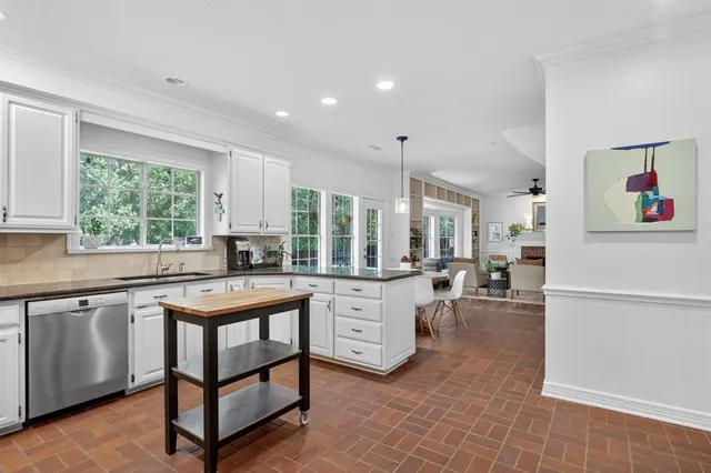 a kitchen with sink cabinets and window