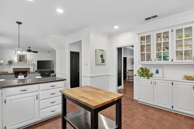 a kitchen with a stove a refrigerator and a sink