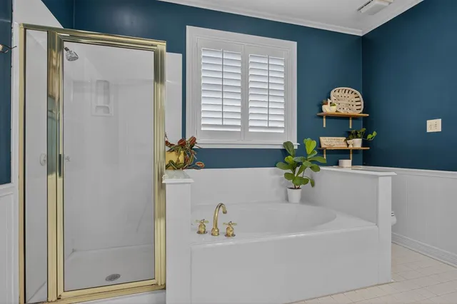 a bathroom with a tub and a sink