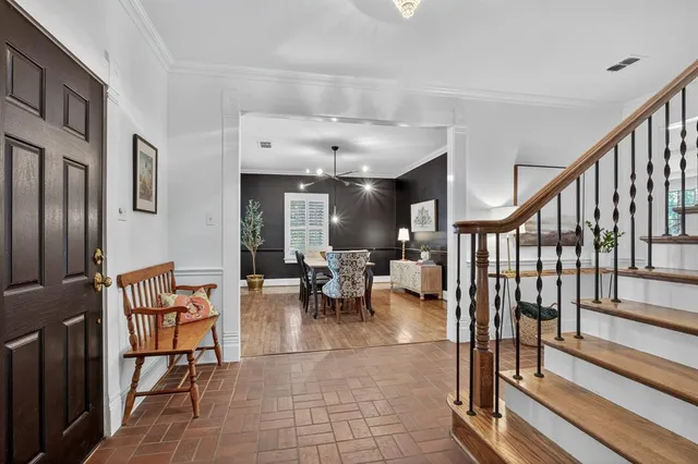 a lobby with furniture and rug